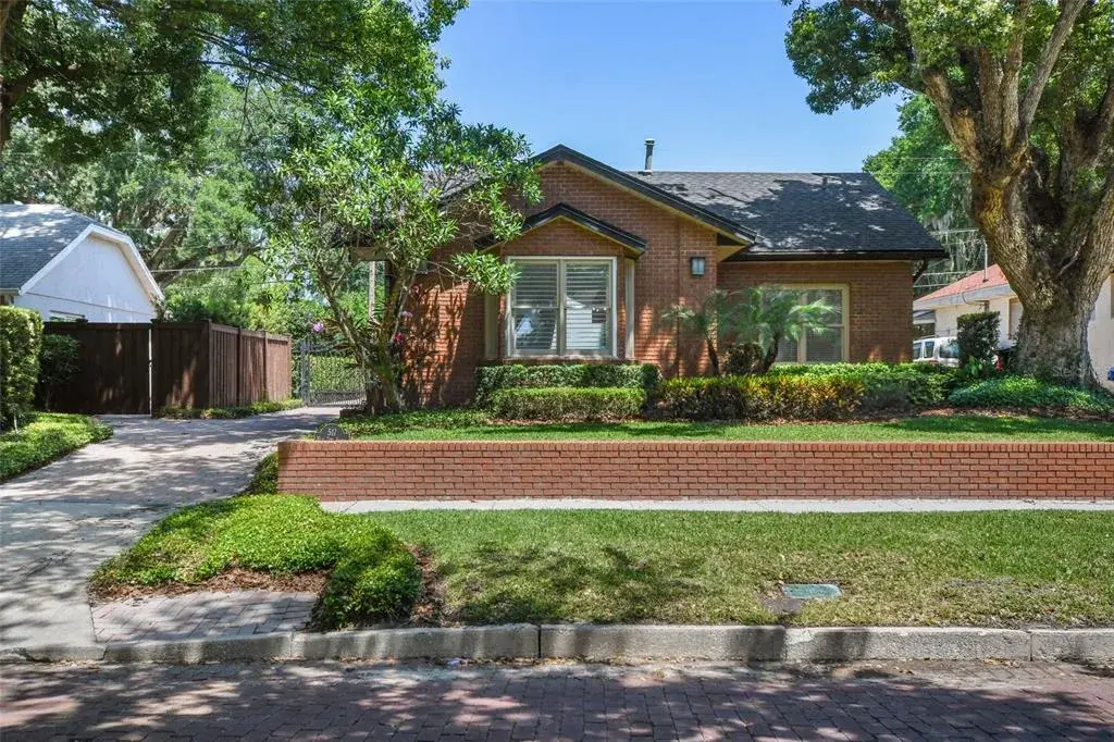 From the street this brick and stucco bungalow radiates charm