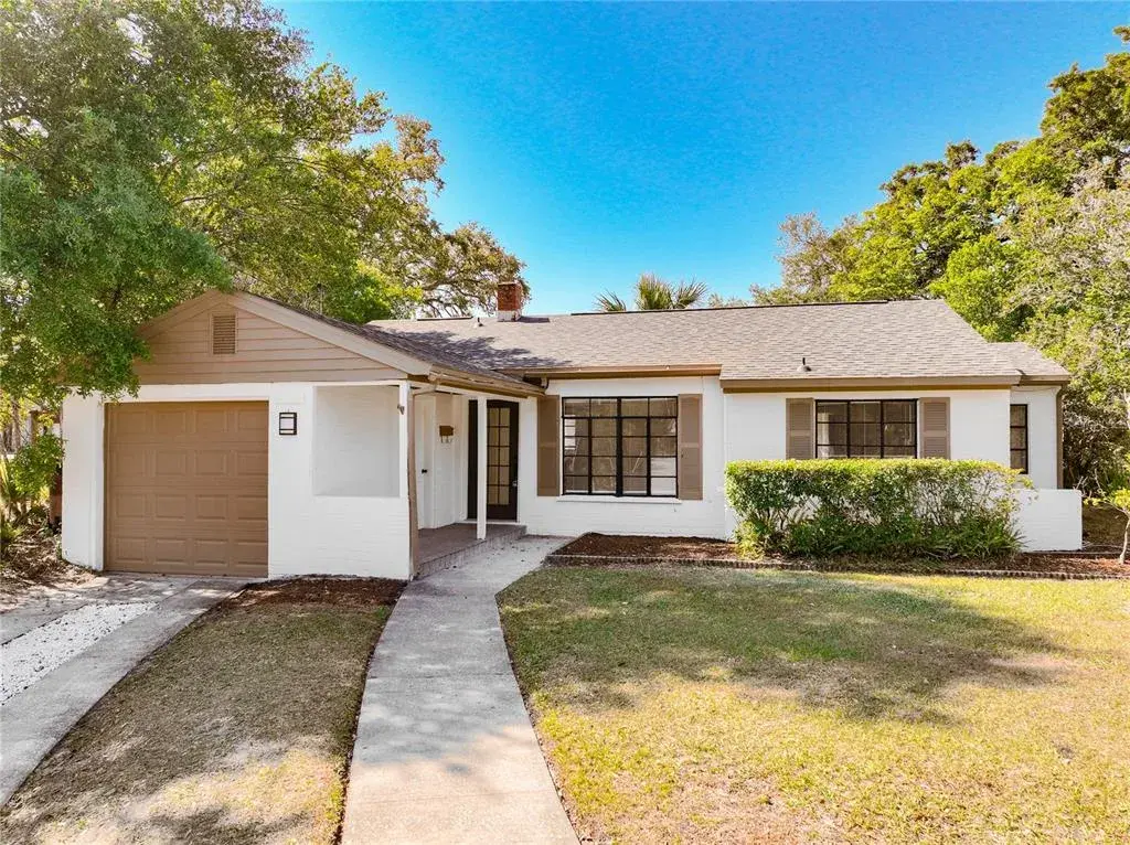 Charming updated home with great curb appeal, 1-car garage, and spacious front yard.