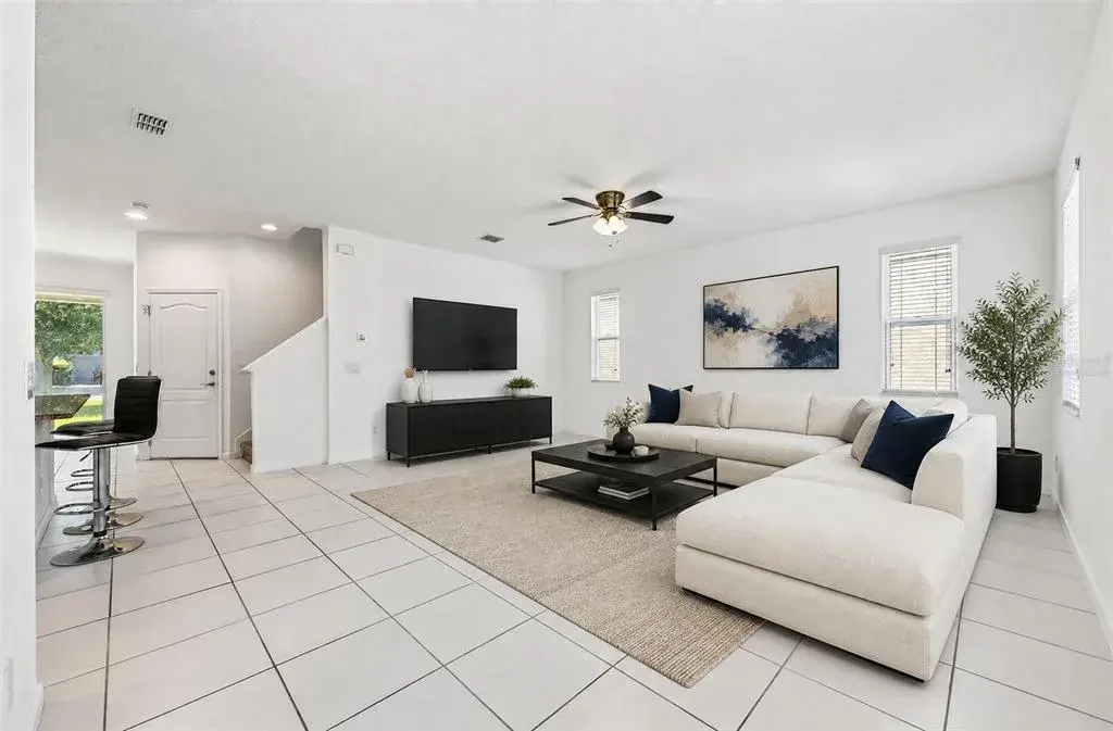 Step inside to find easy-care CERAMIC TILE FLOORS throughout the main living areas and an inviting flow from the spacious Living Room into the Kitchen and Dining area. Virtually Staged