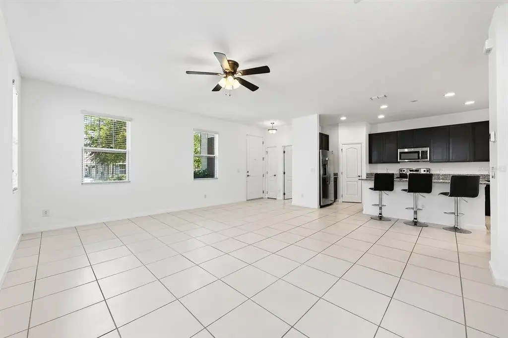 Step inside to find easy-care CERAMIC TILE FLOORS throughout the main living areas and an inviting flow from the spacious Living Room into the Kitchen and Dining area.