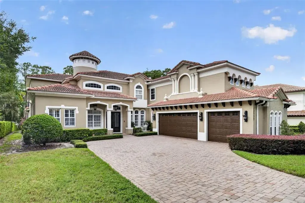 Beautifully landscaped front exterior with a private, welcoming approach.