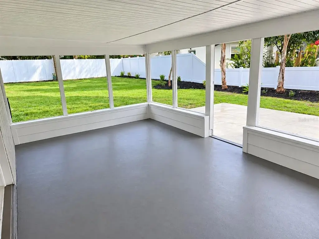 covered and screened rear patio