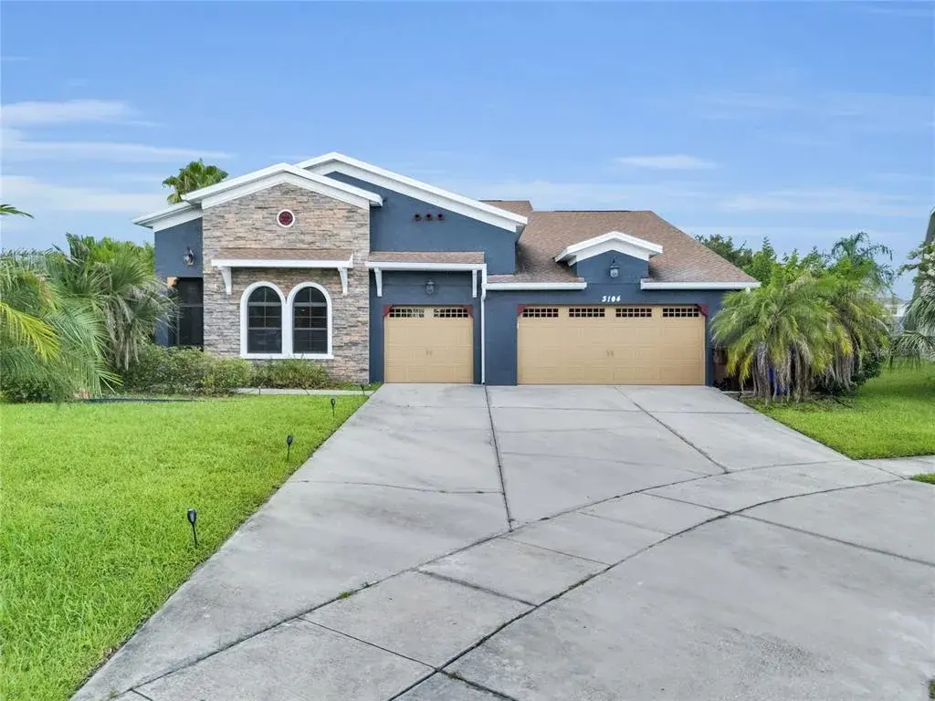 3-car garage with durable epoxy flooring.