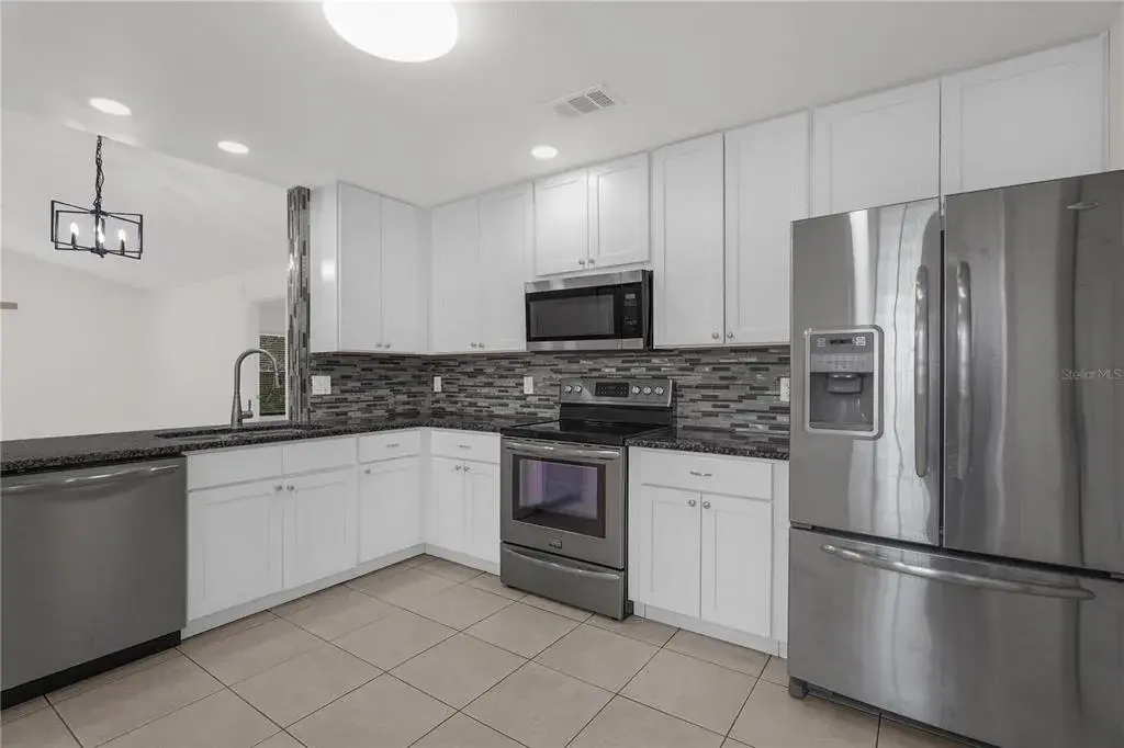 Beautifully updated kitchen with stainless steel appliances.