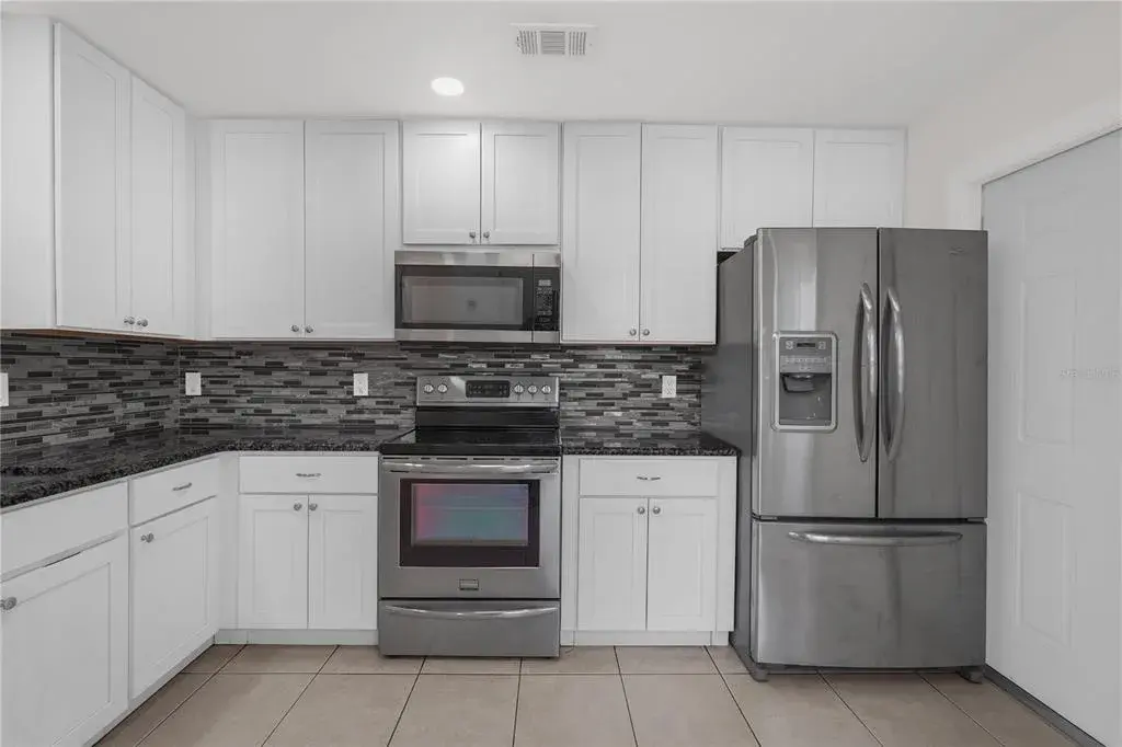 Beautifully updated kitchen with stainless steel appliances.