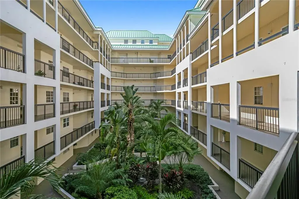 Lush, well-maintained courtyard landscaping creates a serene retreat within the condominium grounds