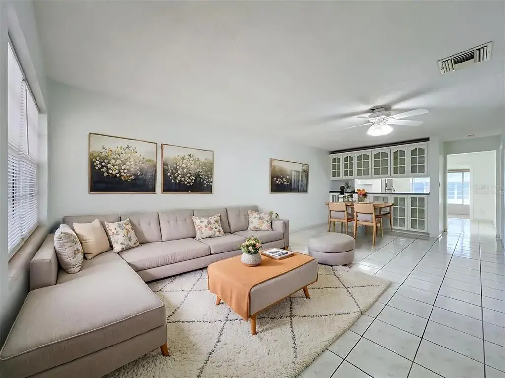 Virtually staged to showcase the possibilities of the spacious living and dining area.