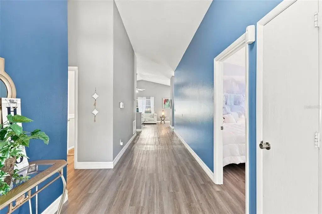 The long hallway creates a natural flow through the home, seamlessly connecting the living spaces and bedrooms.