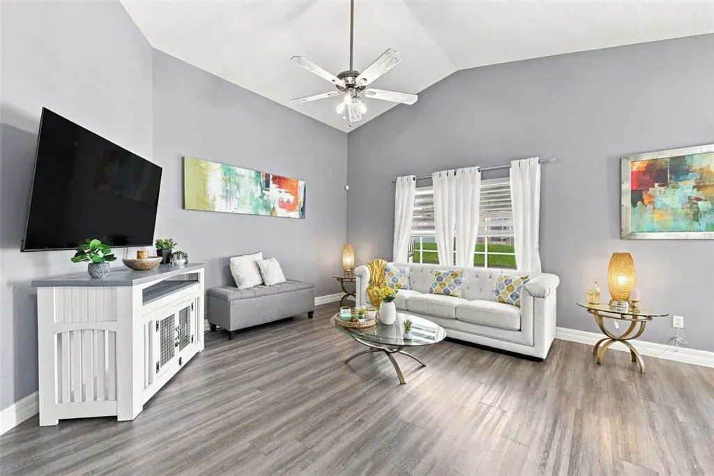 The open and inviting living room offers plenty of space to relax, gather, and entertain while flowing seamlessly into the surrounding living areas.