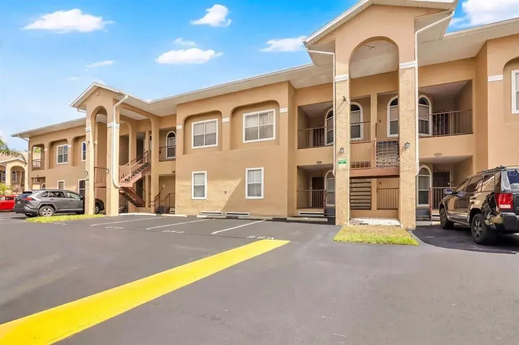 Welcome to Grand Palms, a well-maintained condo community with tropical landscaping and designated resident parking.
