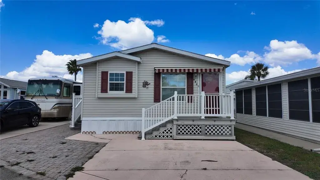 2 bedrooms and 2 bathroom home with dteps leading into the home through the family room