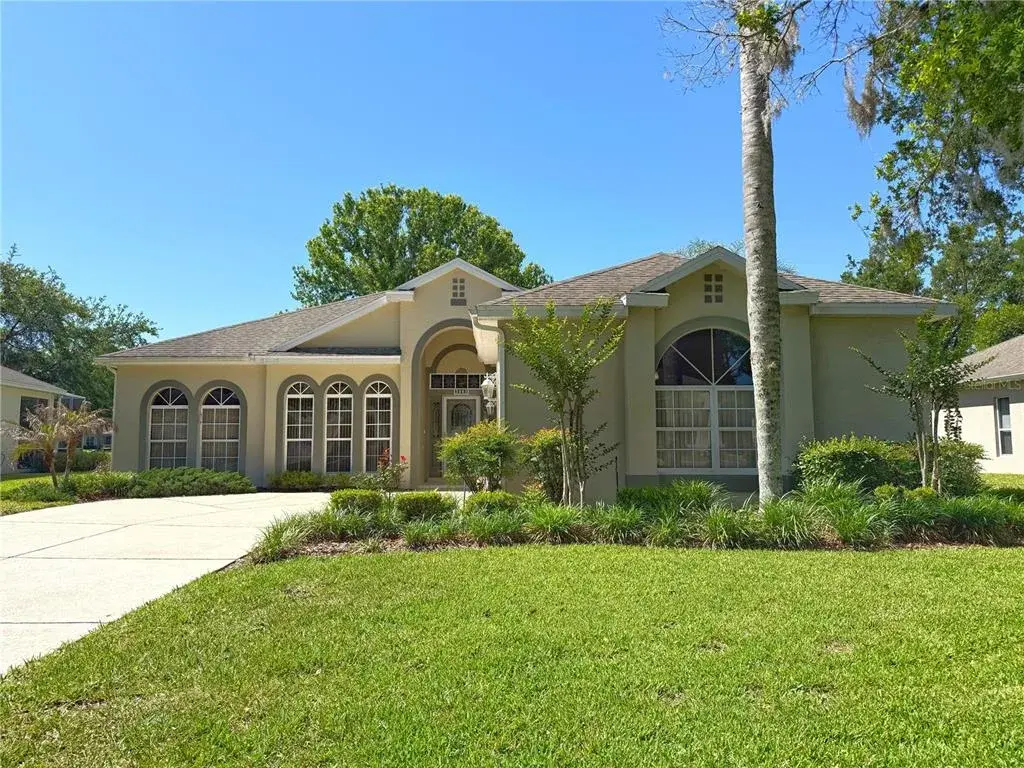 Front exterior with gutters, storm door and two car garage