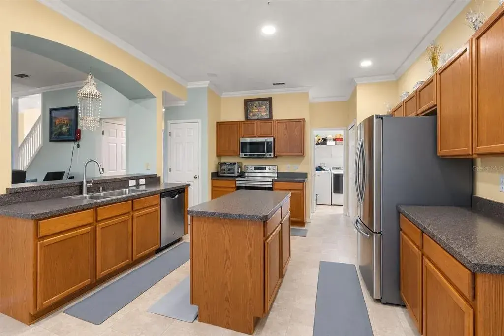 Additional kitchen view highlighting the cabinetry, appliances, and ample workspace.