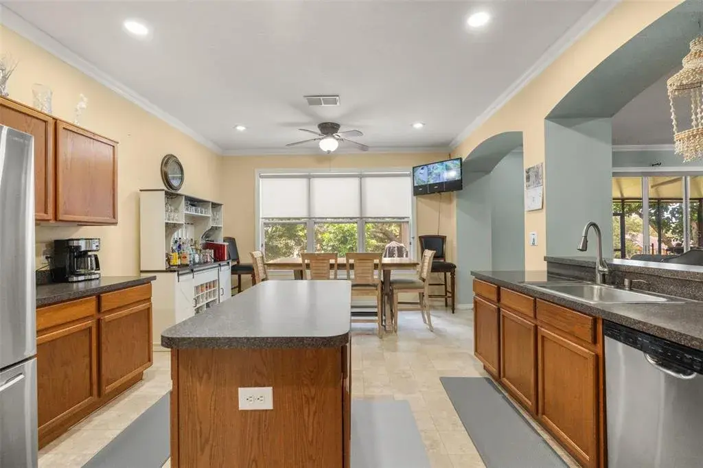 Well-equipped kitchen with center island, ample cabinetry, and generous counter space.