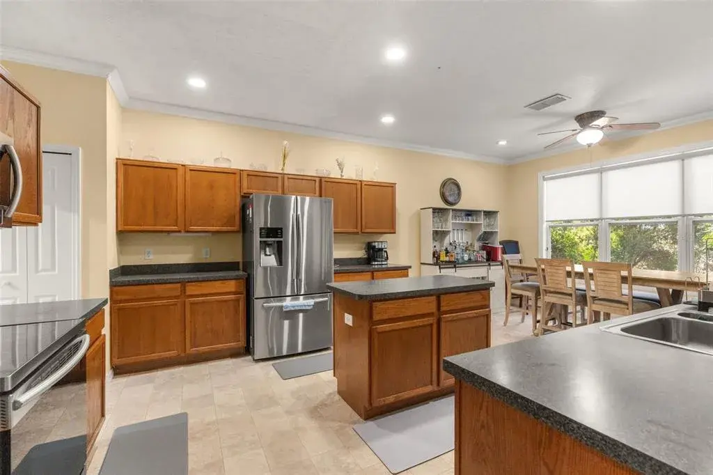 Spacious kitchen featuring stainless steel appliances, abundant cabinets, and a functional layout.