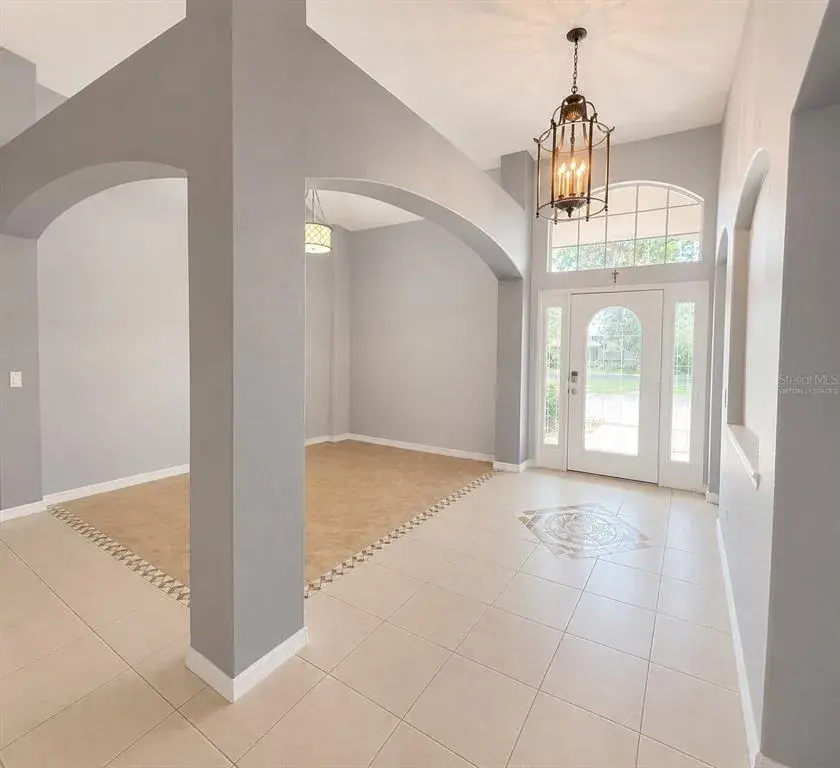 Foyer and Formal Dining Room Virtually Staged