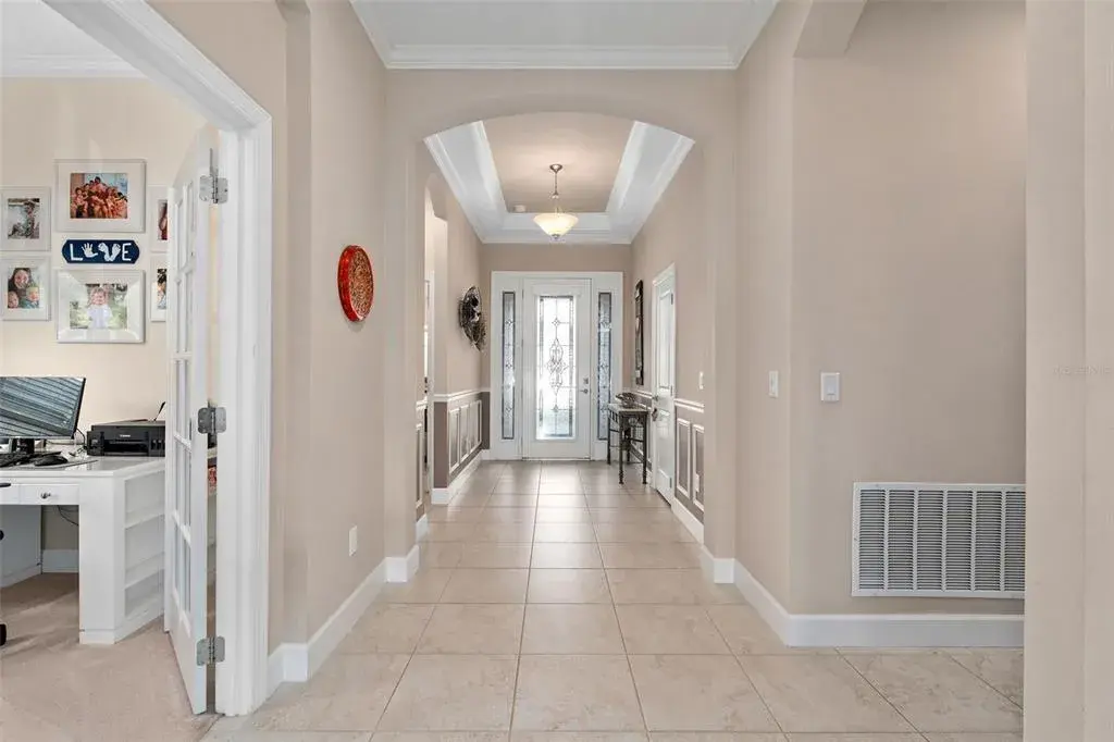 Foyer with a Full Glass Front Entry Door