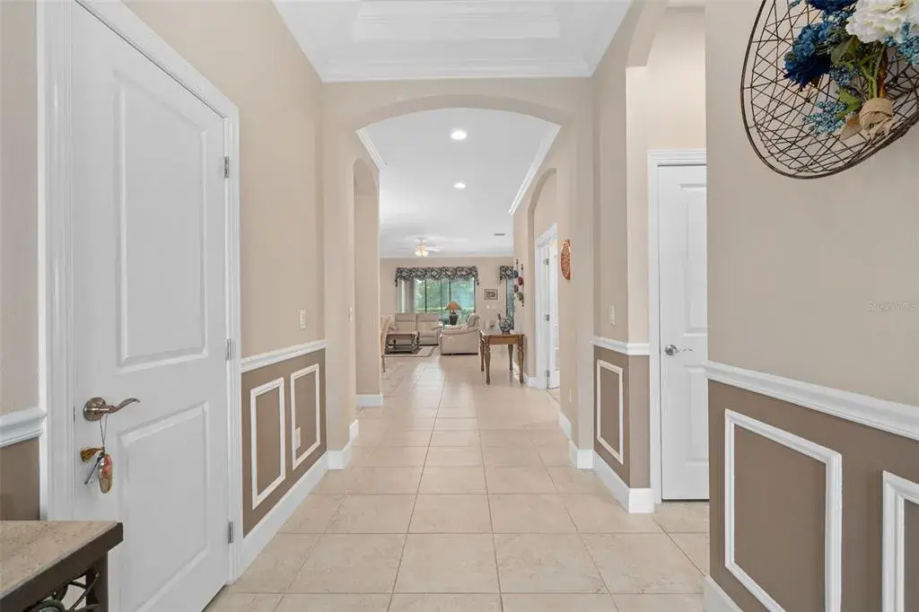 Foyer with Wainscoting leads to a See Through Floor Plan