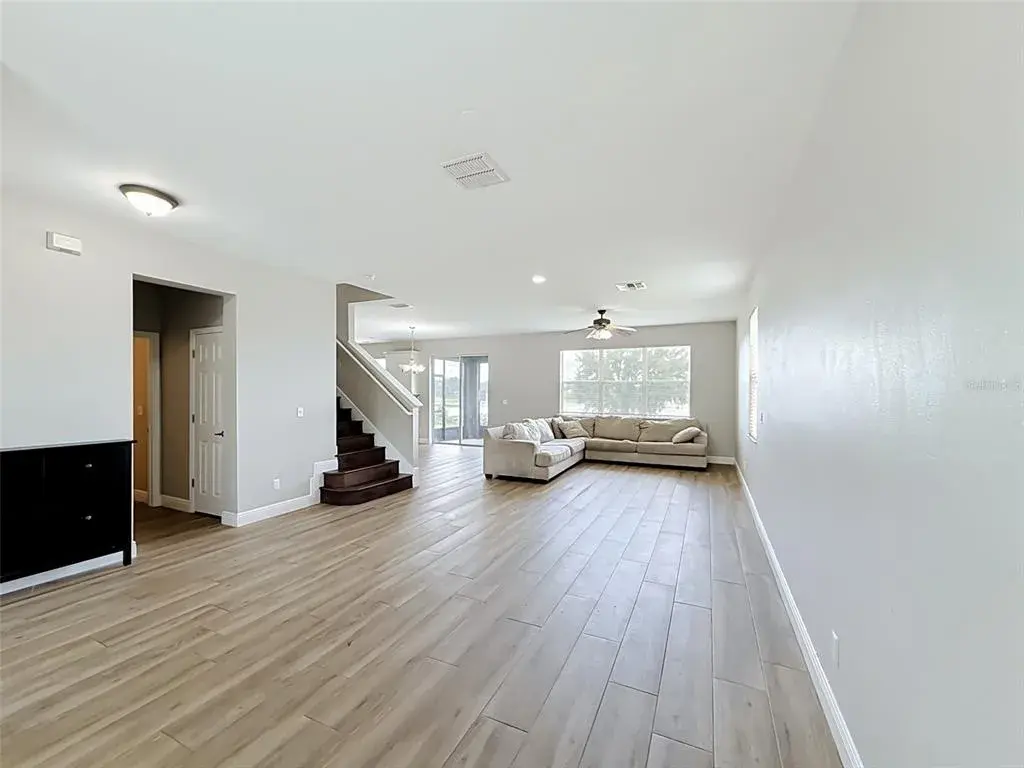 View from the entry through the open great room toward the lake