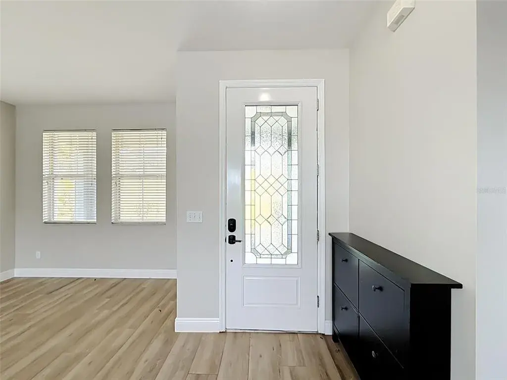Front entry with decorative glass door
