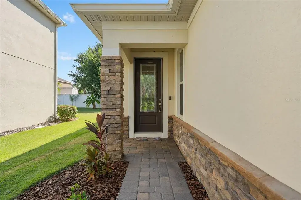 Front entrance with a leaded glass entry door