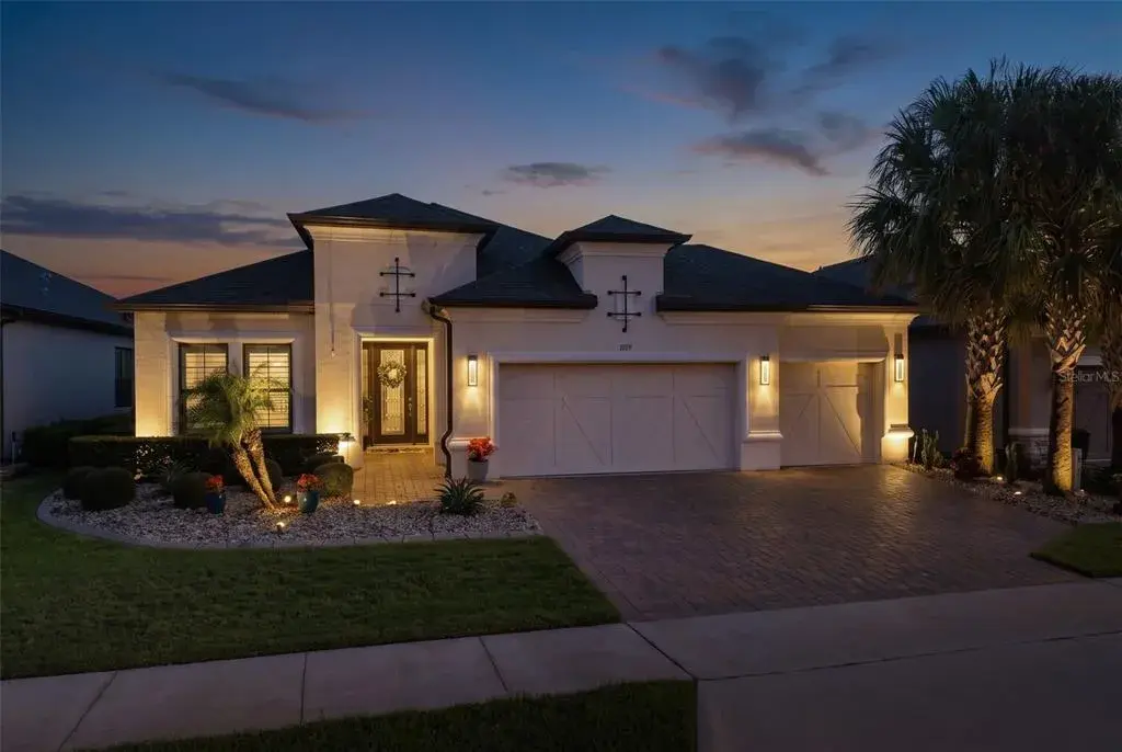 Beautiful curb appeal is accentuated with landscape lighting.