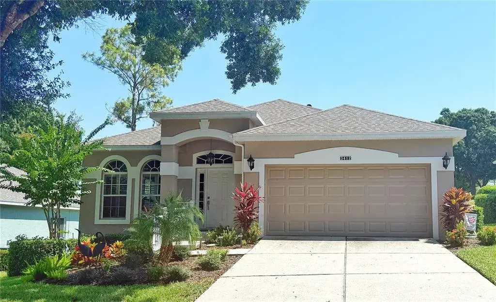 Front exterior with golf course view, gutters