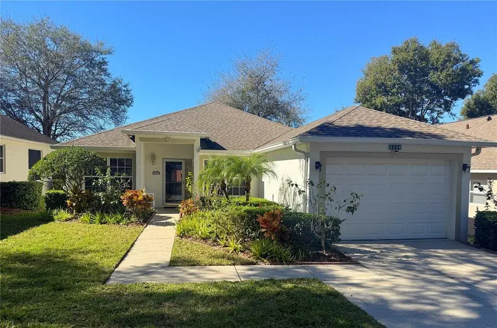 Front exterior with gutters and glass storm door. Side window beside front door. Amazing views of the sunsets.