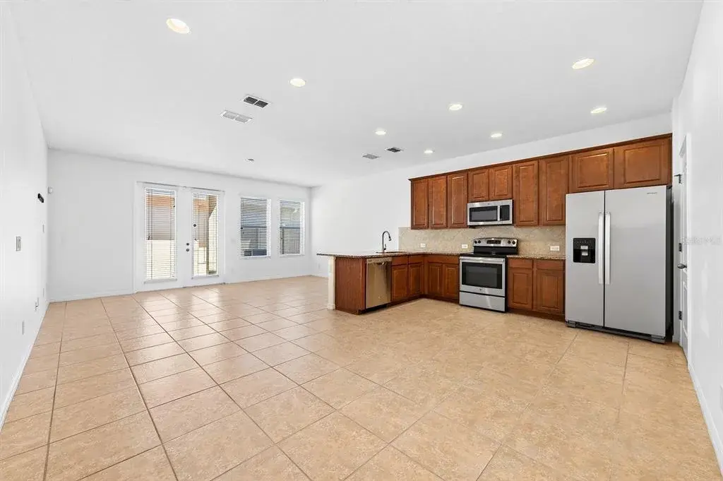 Inside, TILE & WOOD LAMINATE FLOORING flow throughout the home, while the light-filled OPEN CONCEPT design makes everyday living and entertaining effortless.