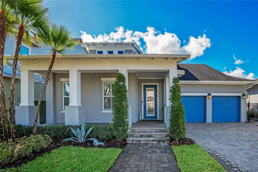 Welcome to 8336 Canetti St in Laureate Park, Lake Nona, Orlando FL 32827. A 2020 David Weekley Shalimar with contemporary curb appeal, lush palms, and a two car garage.