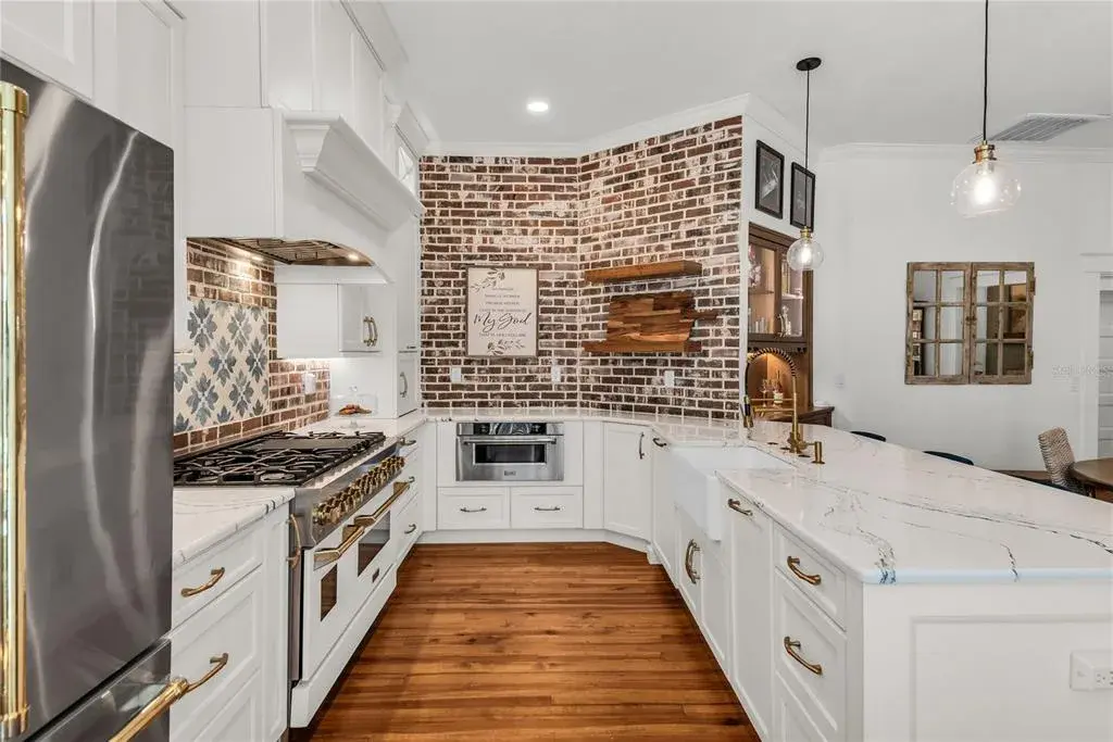 The chef's kitchen is a true focal point with a distinctive mix of old-world charm and modern design that combine luxury and function
