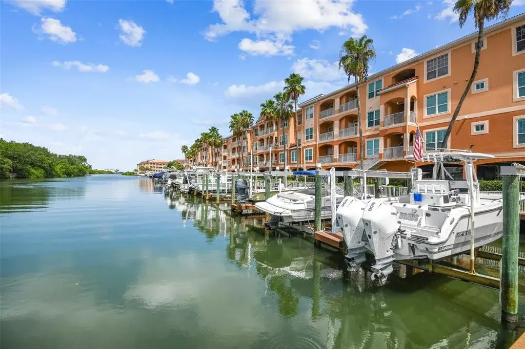BOAT SLIP INCLUDED (BOAT SLIP #3, CLOSEST TO UNIT AND POOL, CLUBHOUSE, GRILLING PICNIC AREA)