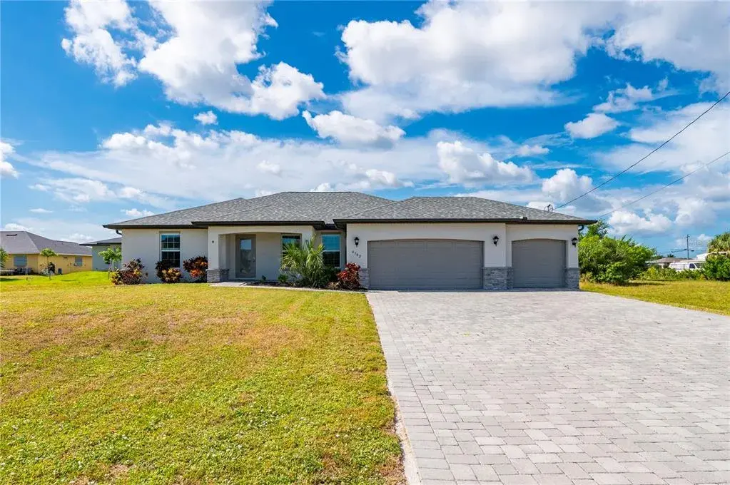 Outside View of Home with Pavered Driveway