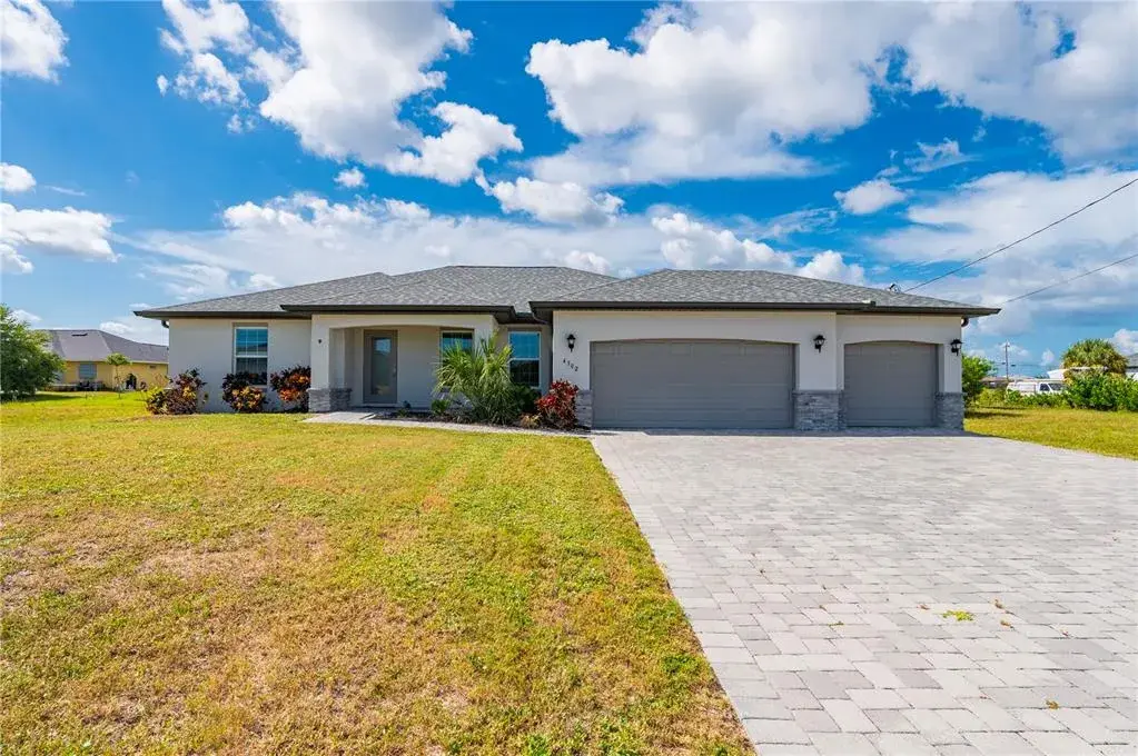 Outside View of Home with Pavered Driveway