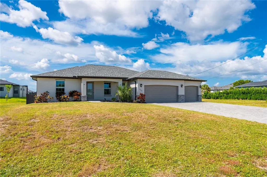 Outside View of Home with Pavered Driveway