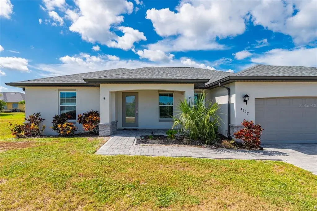 Outside View of Home with Pavered Driveway