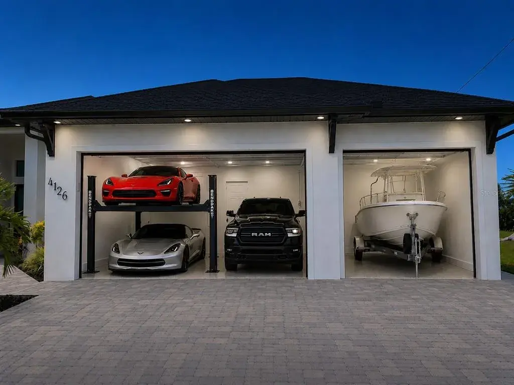 9 Foot tall garage doors and room for 3 lifts or a 22 foot boat on trailer