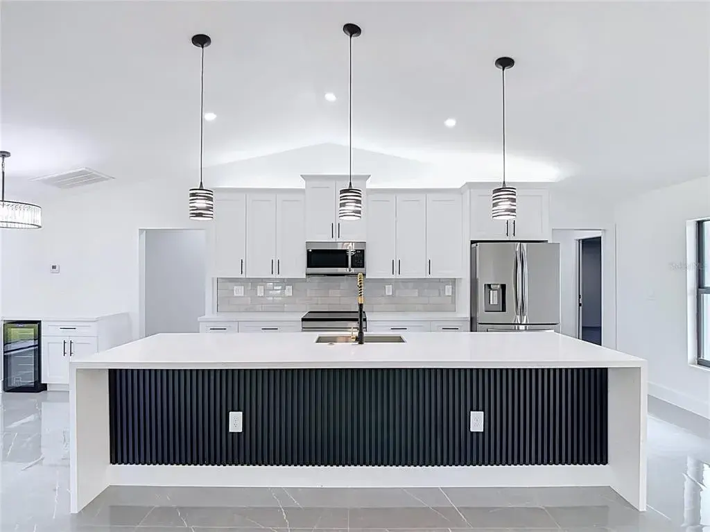 View of extraordinary gourmet kitchen with 10 foot Waterfall Island