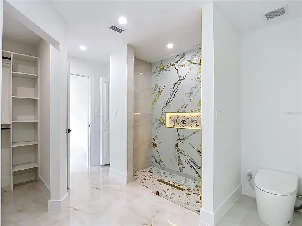 Primary bathroom with walk in closet, exceptional shower and smart toilet with bidet.
