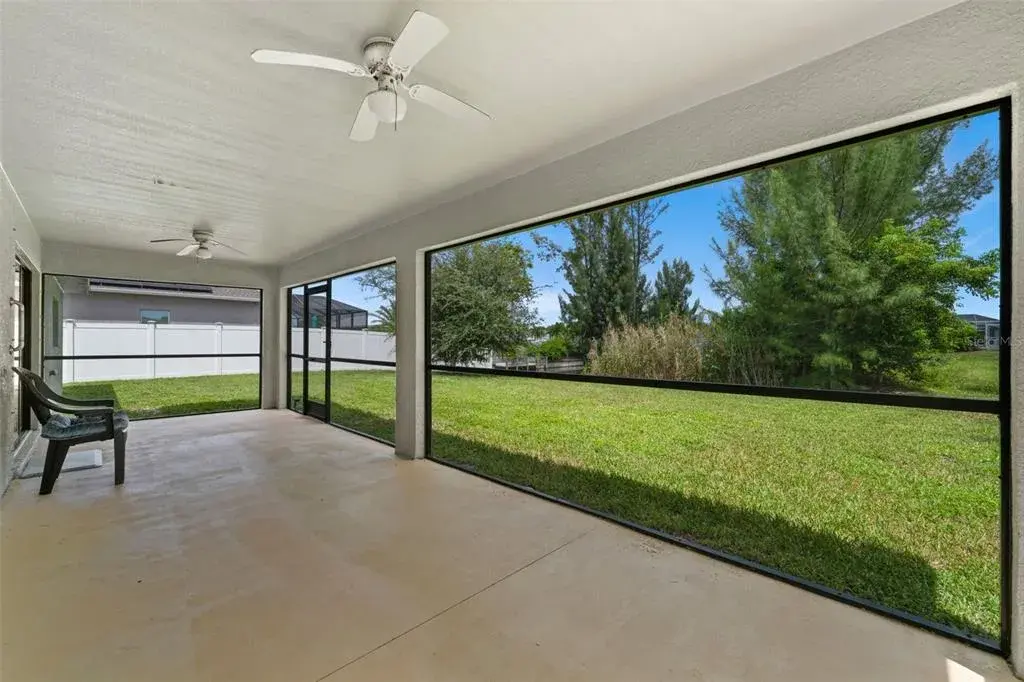 Sit on the Large screened lanai while you watch birds!