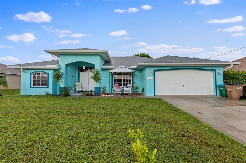 Front view with gazeebo and two-car garage