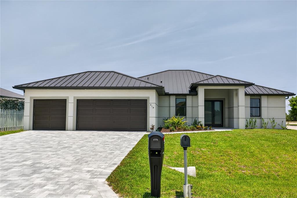 This CONTEMPORARY LUXURY HOME features SCREENED, HEATED POOL & SPA & 4 BEDS (2 primary suites) & 3 full BATHS, layout is ideal for EVERYDAY LIVING & ENTERTAINING!