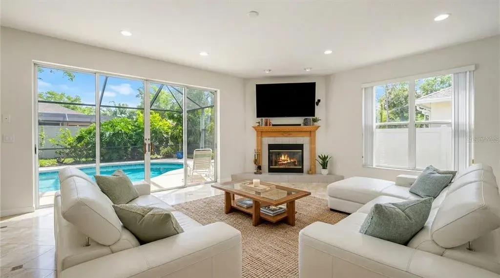 Spacious living room featuring an open-concept design with seamless entry access.