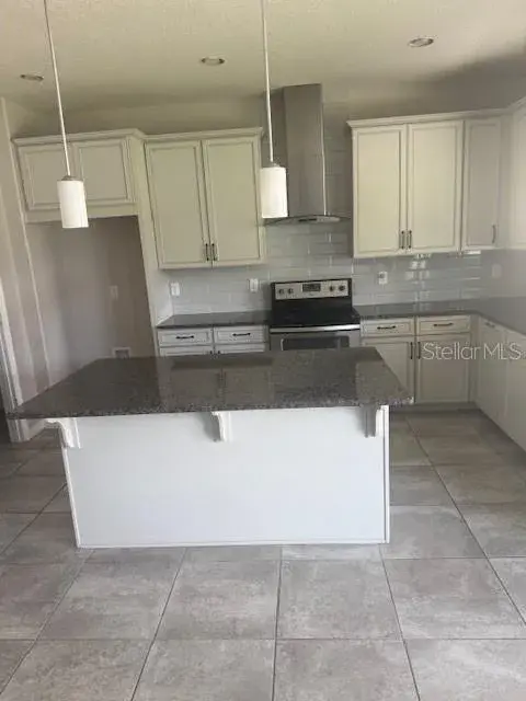The Chef in your house will Enjoy this Spacious Kitchen with UpgradedCabinets and a separate Island.