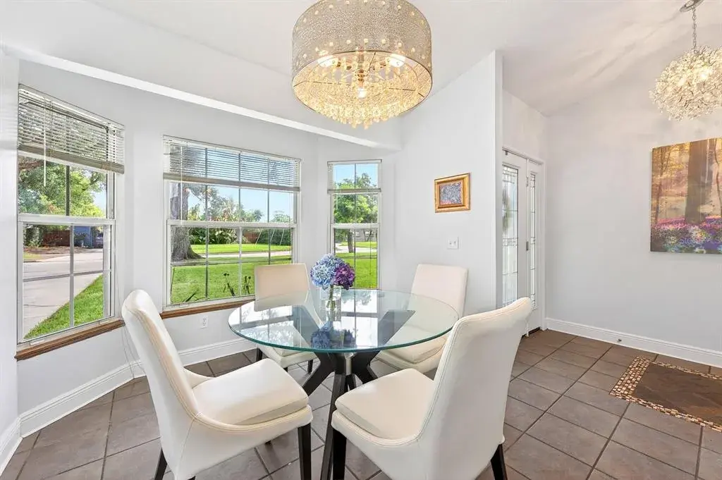 The formal Dining Room features a LOVELY BAY WINDOW overlooking the front yard, creating a bright and elegant setting for gatherings and special occasions.