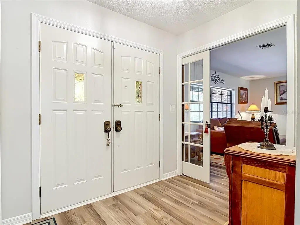 Large foyer area with French doors leading into living room