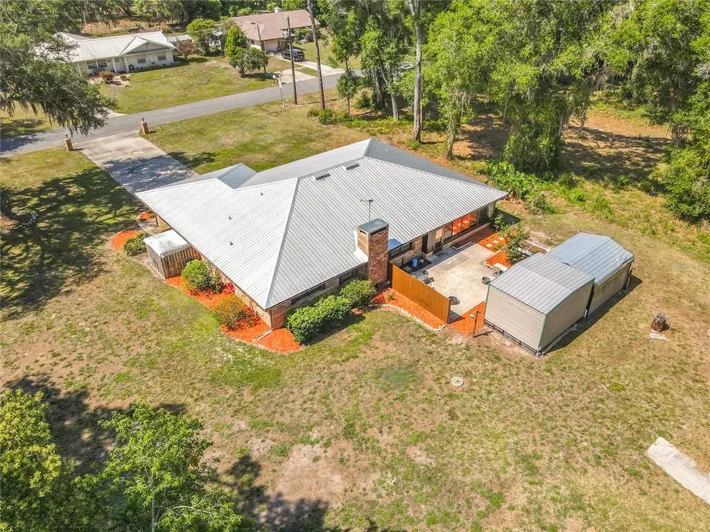Spacious yard for this gorgeous home and outbuildings.
