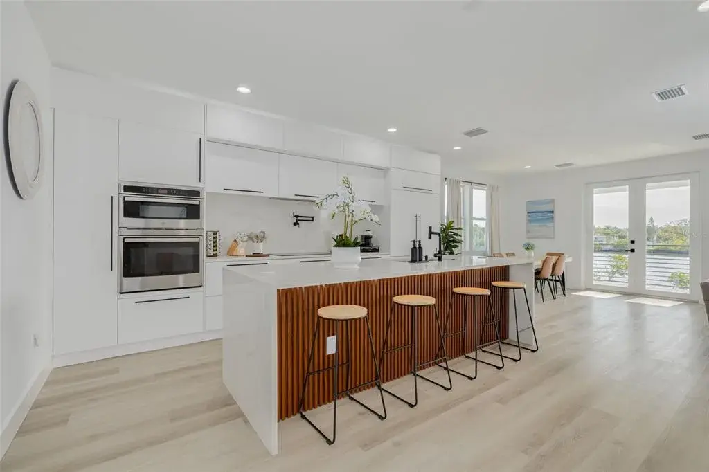 Kitchen, dining and living area on main level with beautiful water views.
