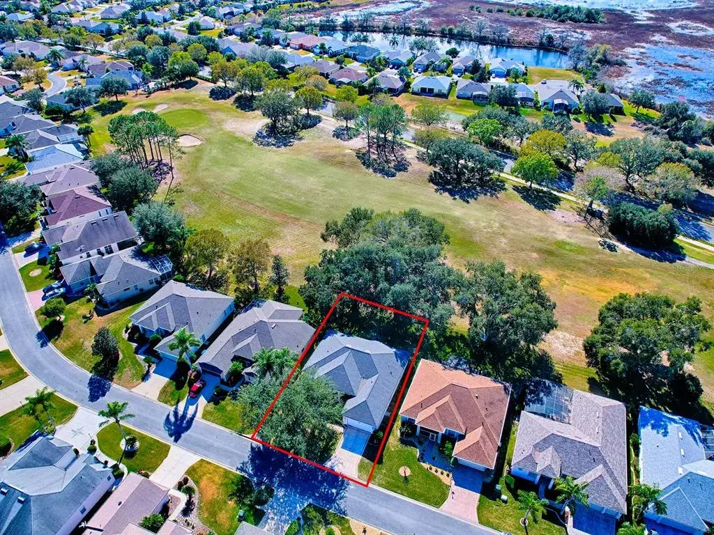 Aerial View with Golf Course behind home.