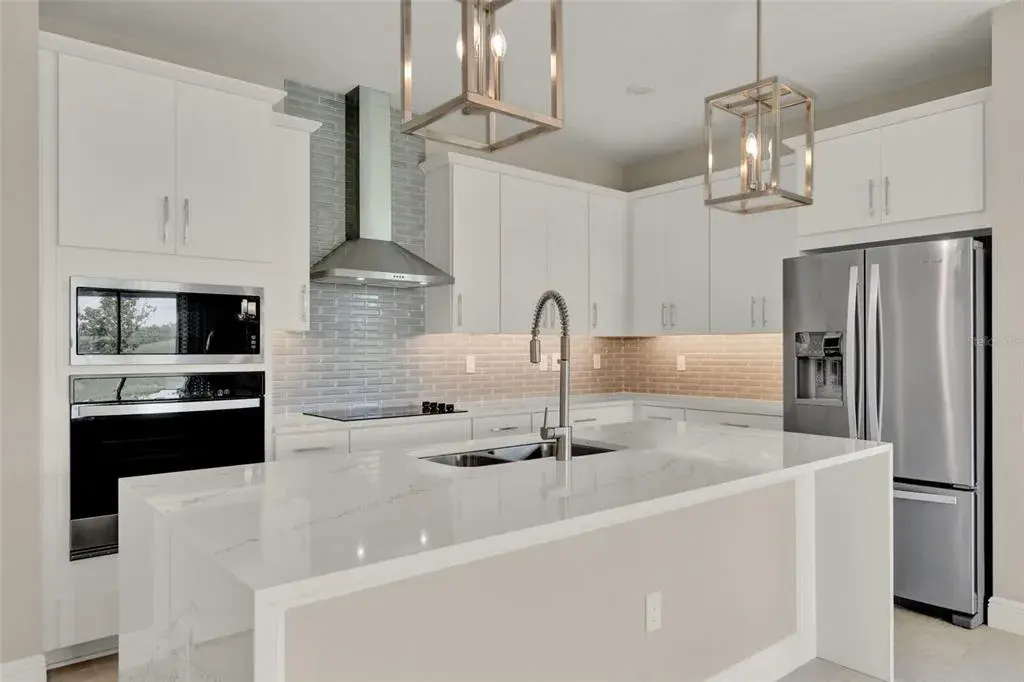 Model Home design - everything upgraded in this GOURMET KITCHEN - ISLAND IS 3 SIDED QUARTZ!